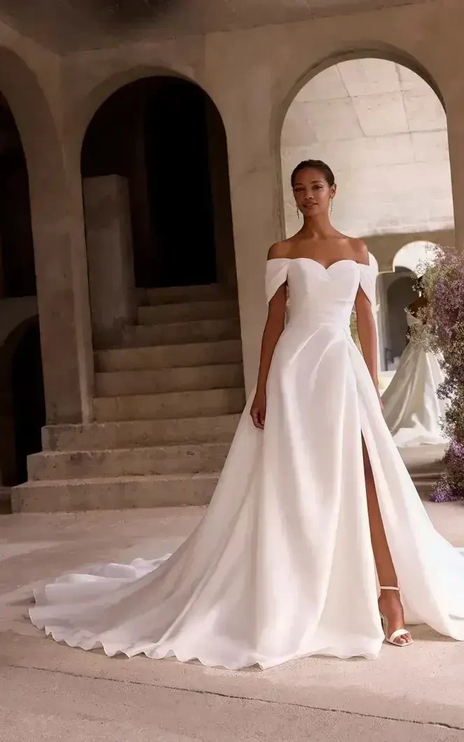 Model wearing a white wedding dress