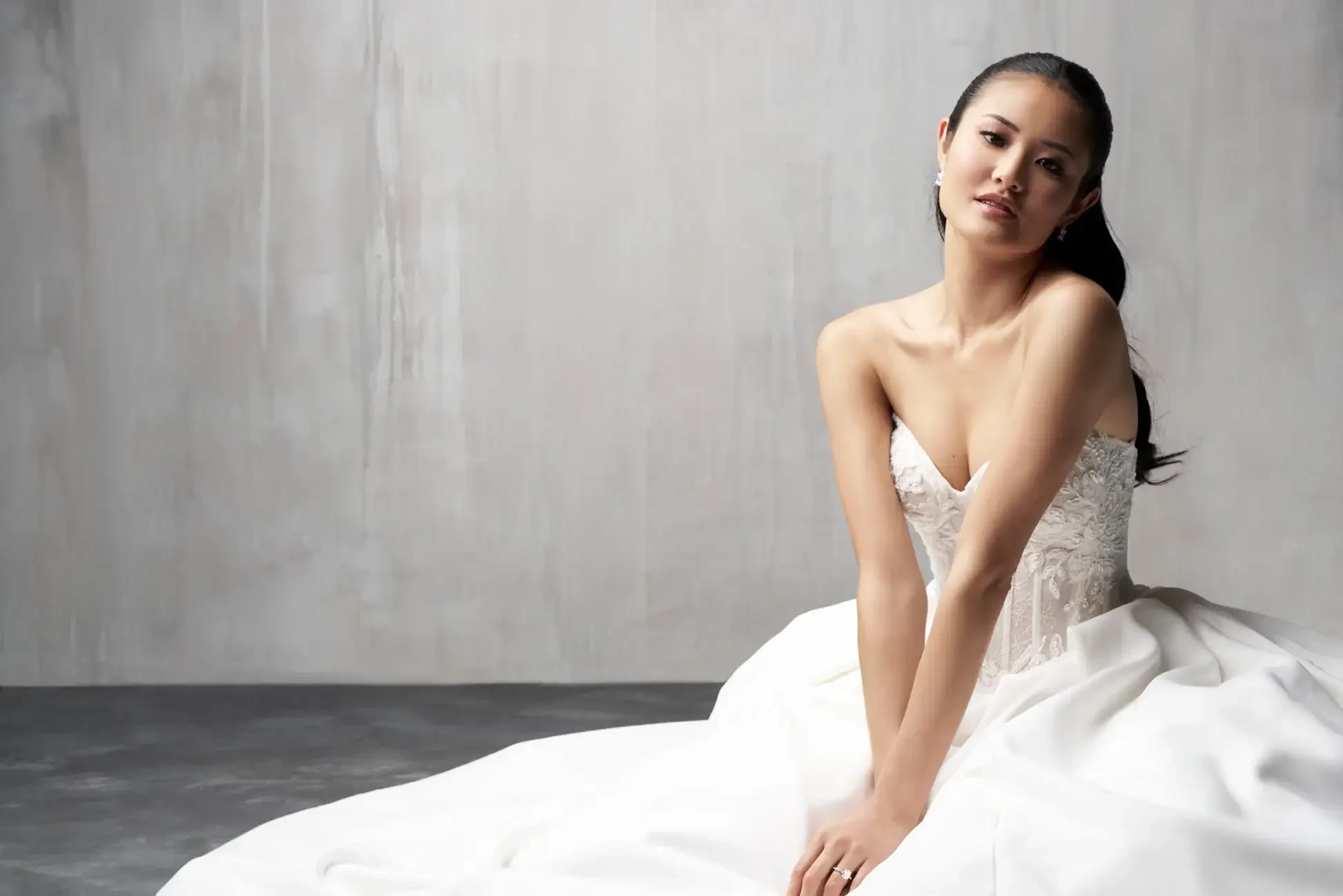Model wearing a white wedding gown.