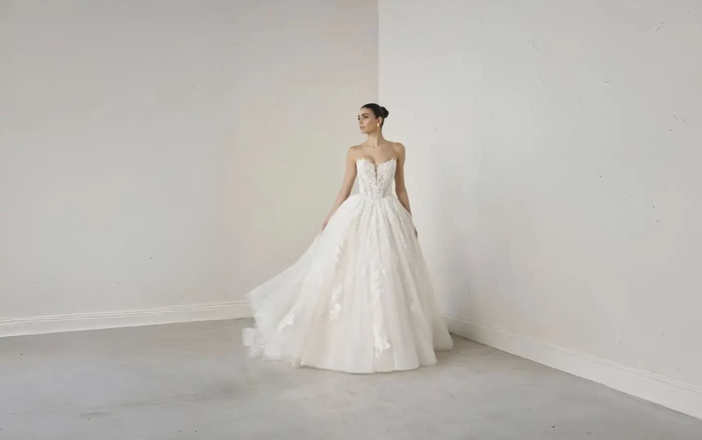 Model wearing a white wedding dress