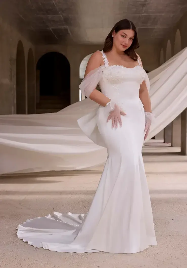 Model wearing a white wedding dress