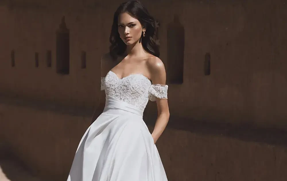 Model wearing a white wedding dress
