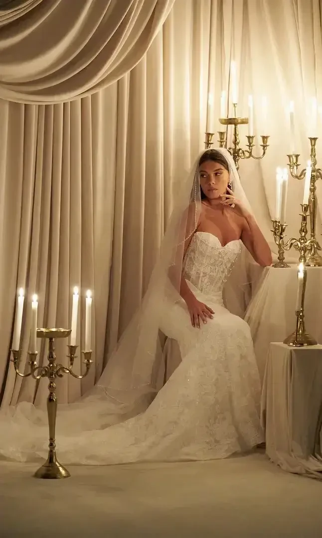 Model wearing a white wedding gown.