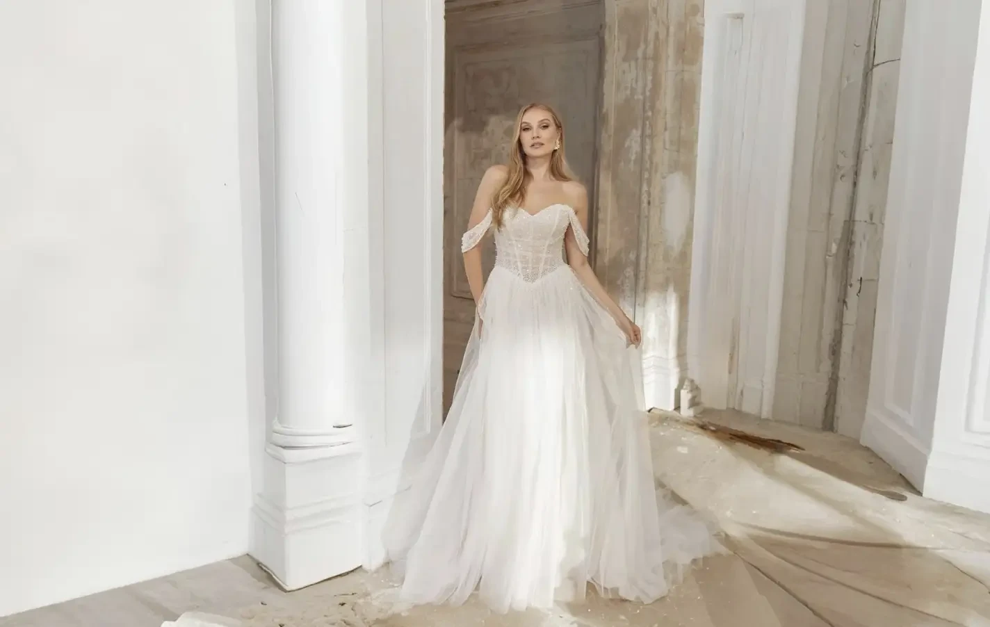 Model wearing a white wedding dress