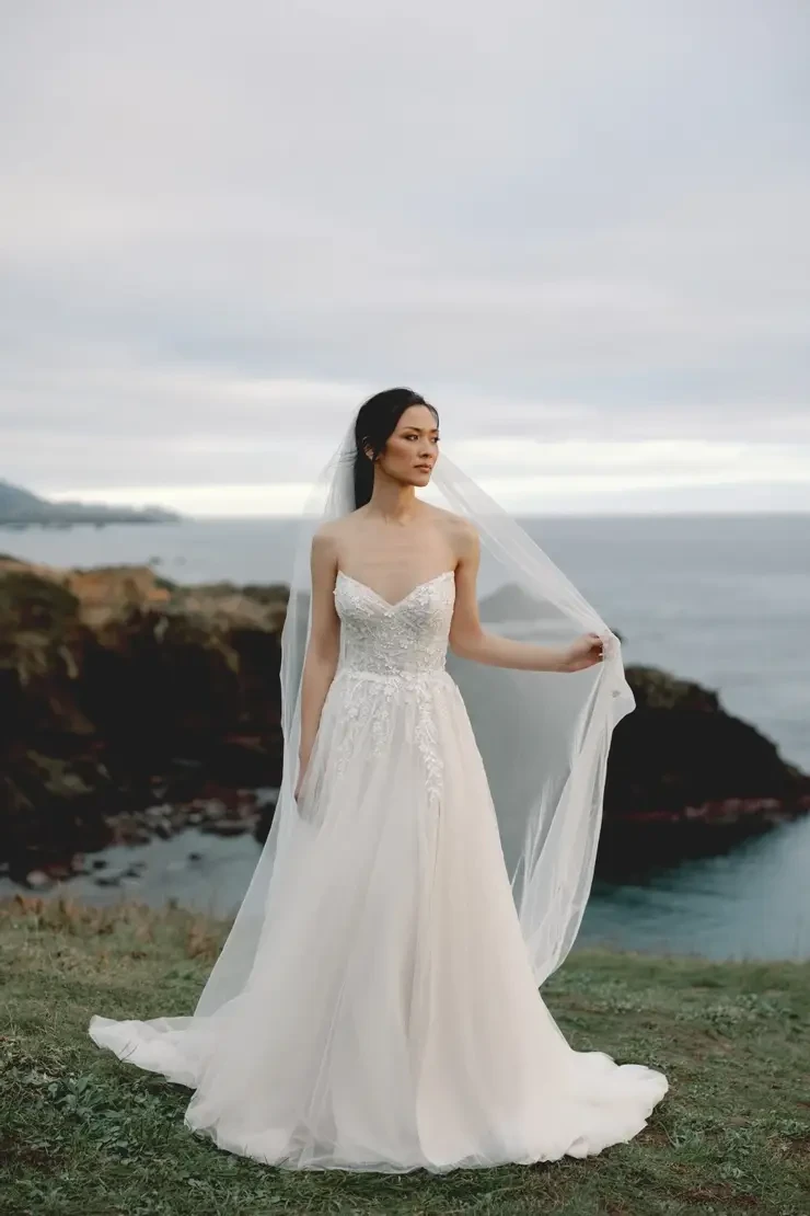 Model wearing a white wedding dress