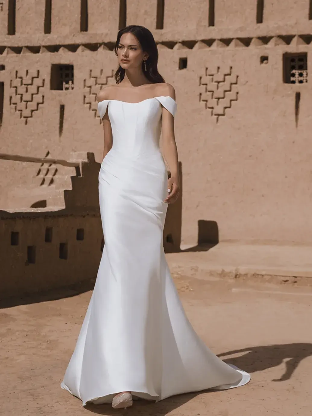 Model wearing a white wedding dress