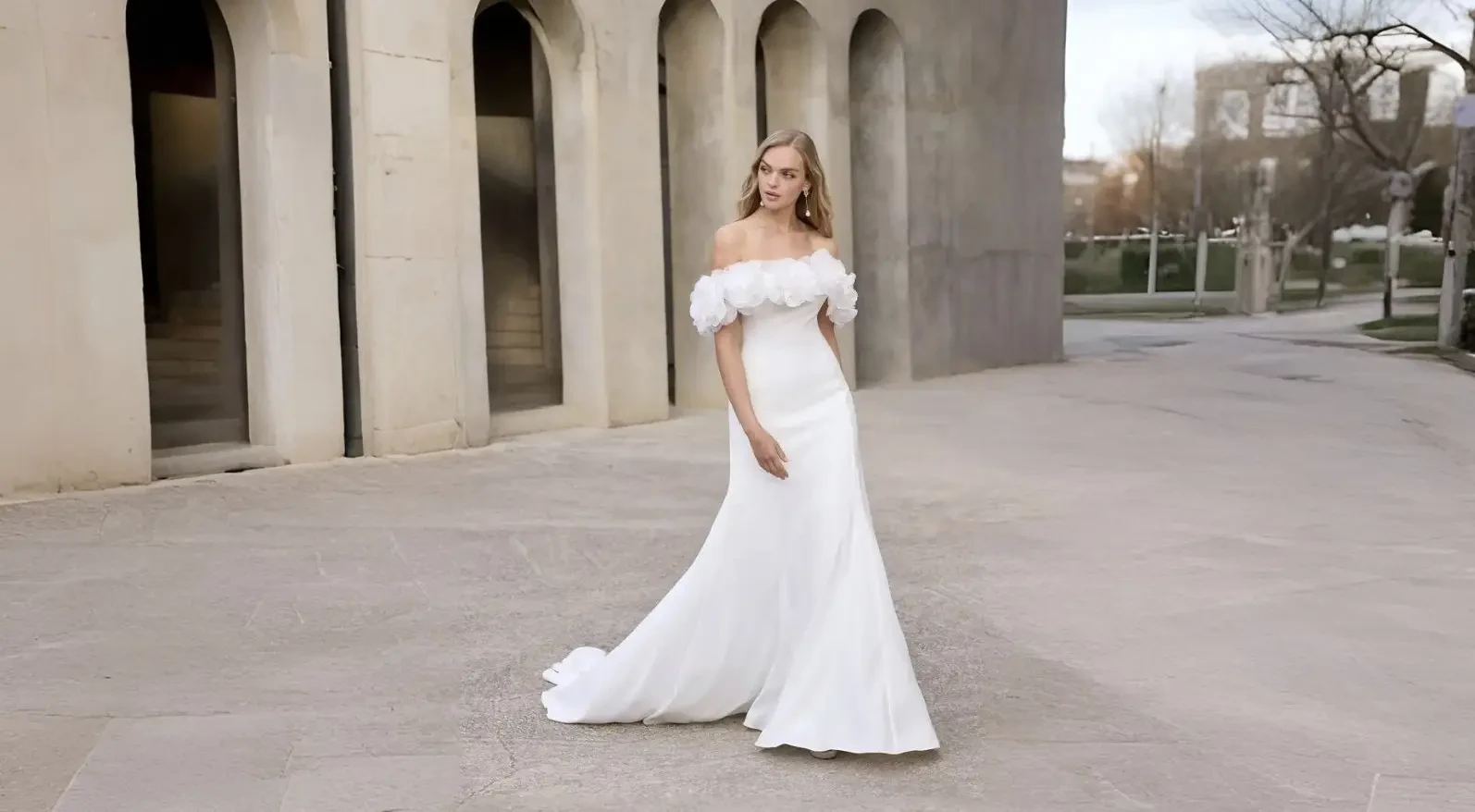 Model wearing a white wedding dress