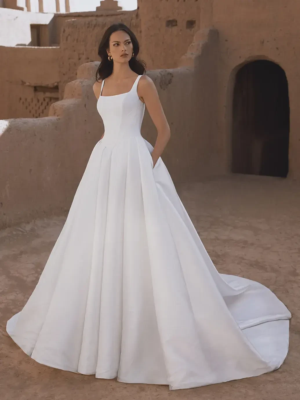 Model wearing a white wedding dress