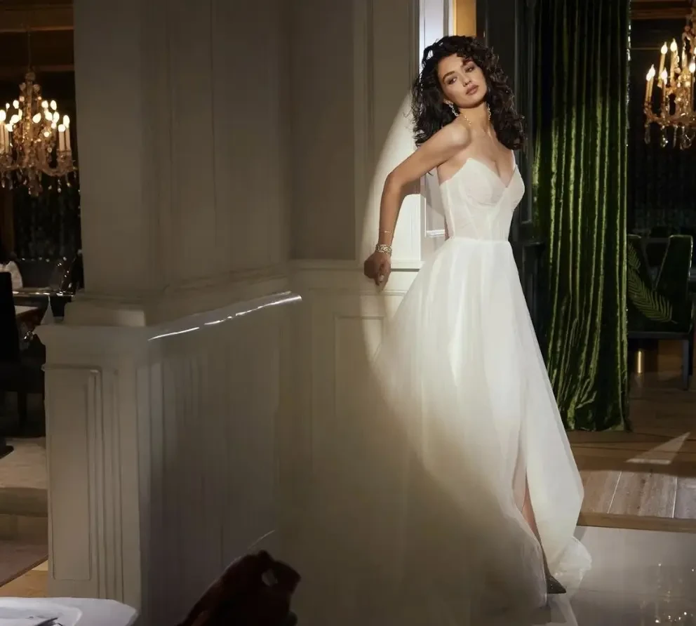 Model wearing a white wedding gown