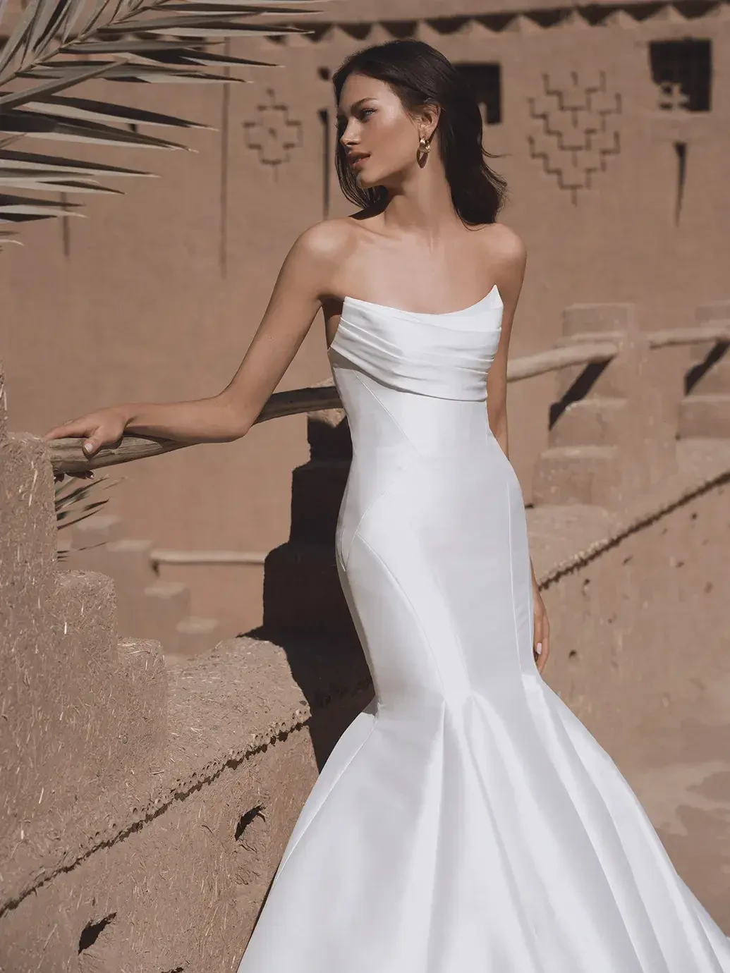 Model wearing a white wedding dress
