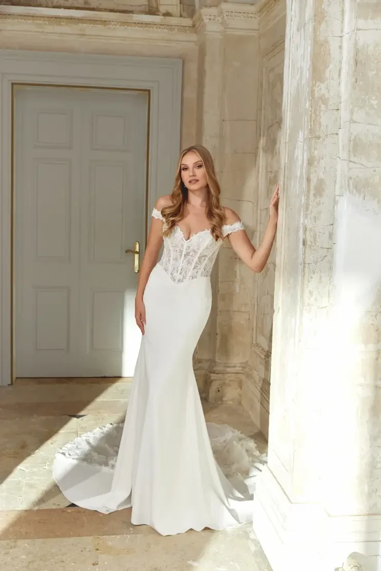 Model wearing a white wedding dress