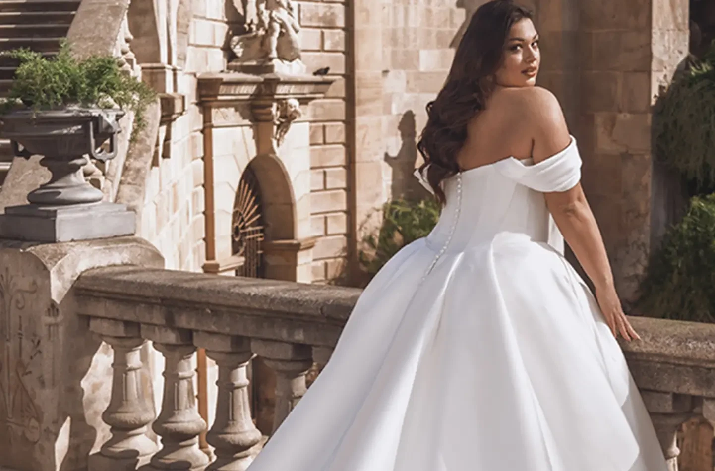 Model wearing a white wedding dress