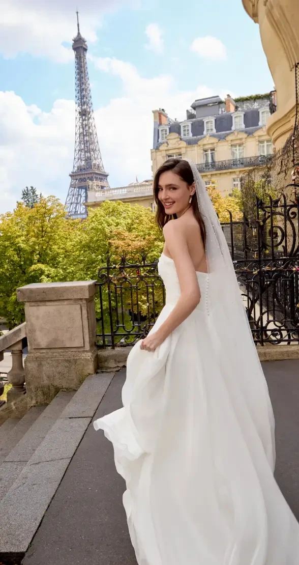 Model wearing a white wedding dress
