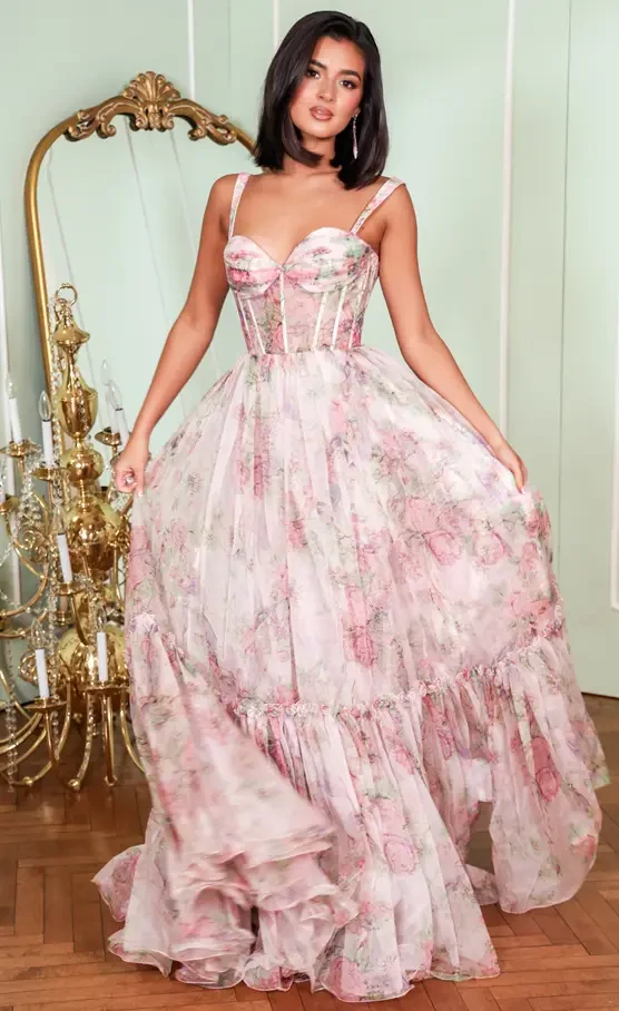 Model wearing light pink floral prom dress