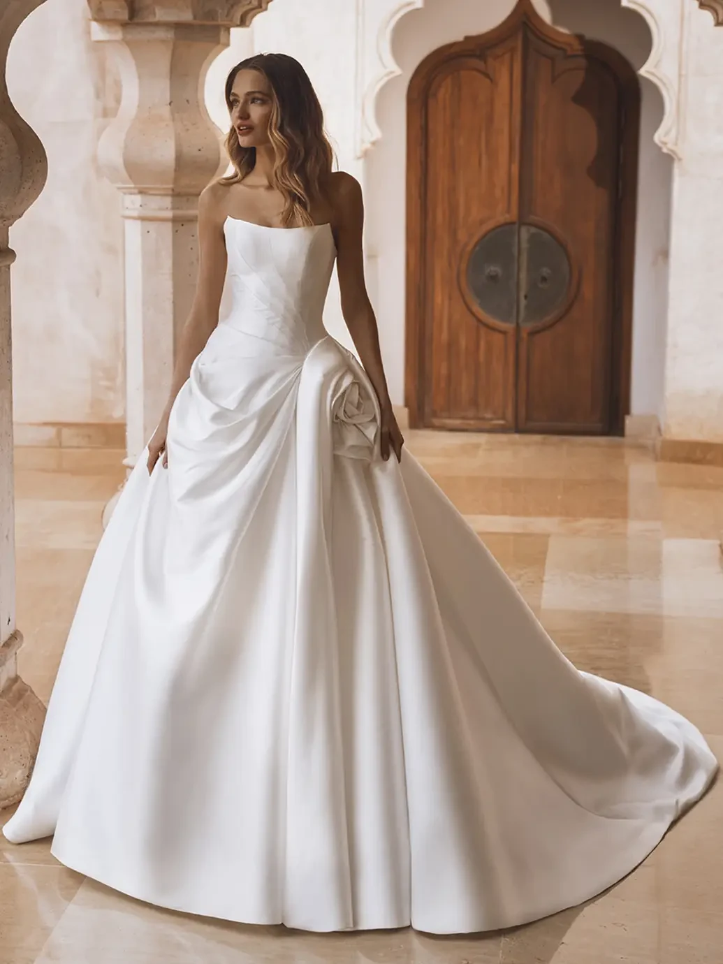 Model wearing a white wedding dress