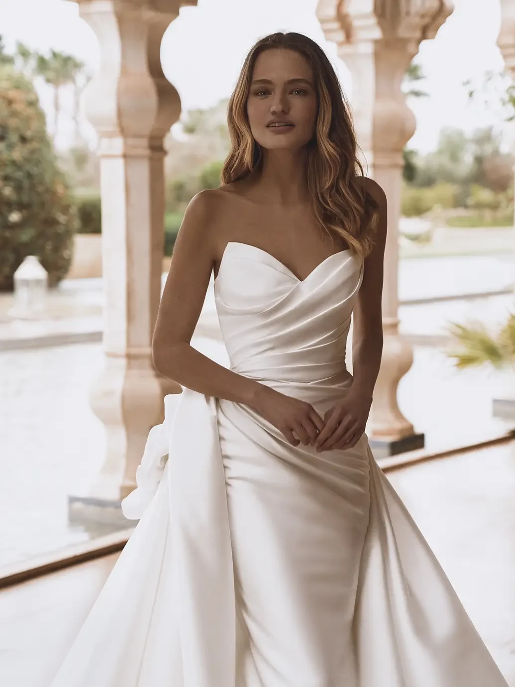 Model wearing a white wedding dress